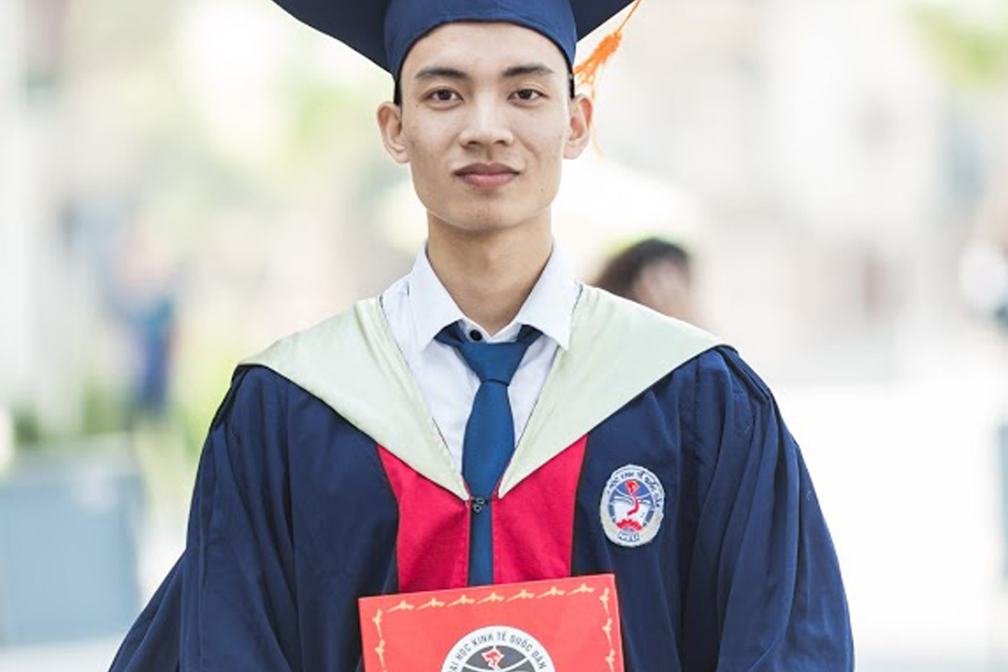 cropped-Man-In-Toga-Holding-Diploma.jpg