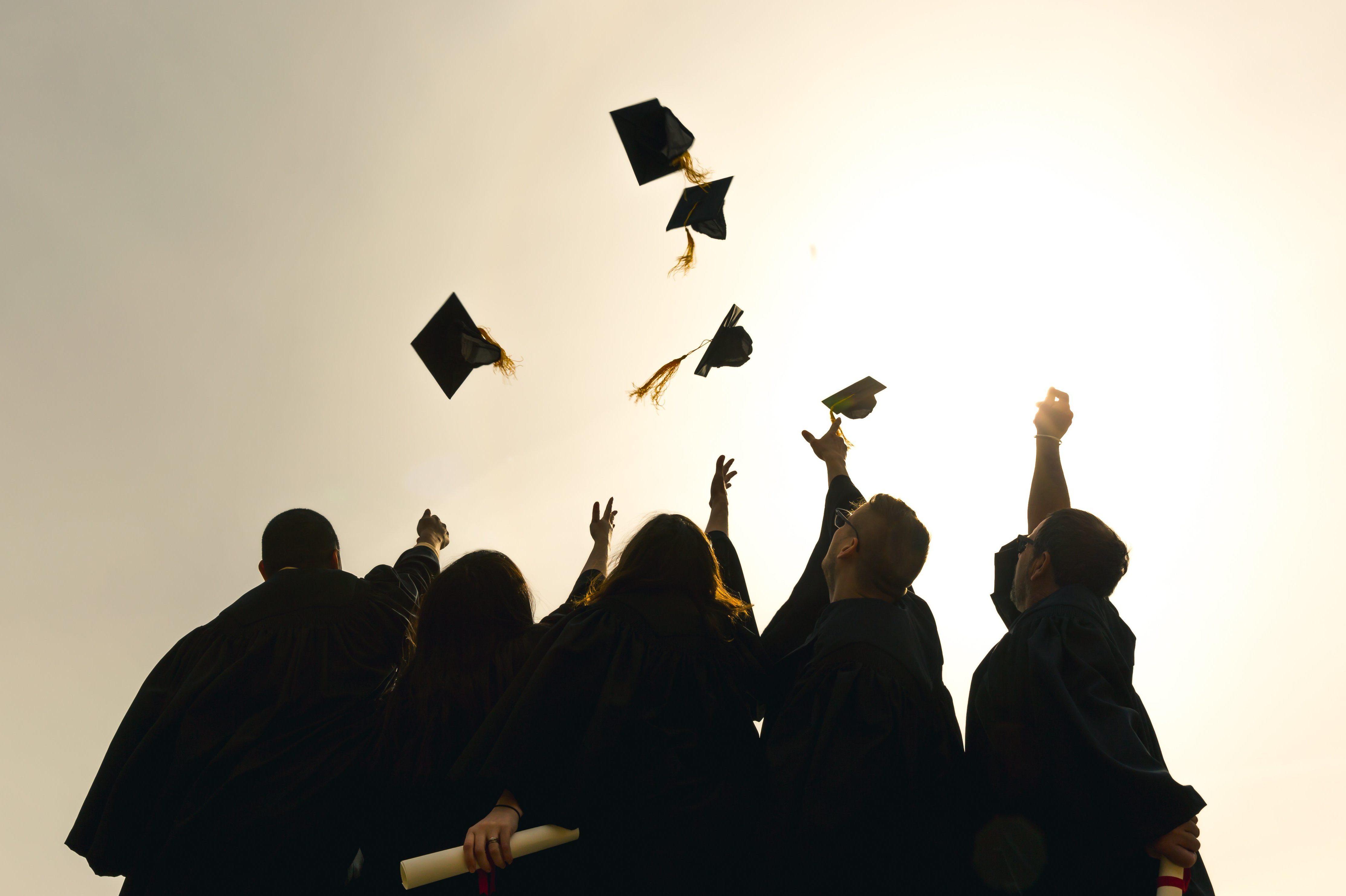 cropped-cropped-grad-students-throwing-hats-in-the-air_4460x4460.jpg